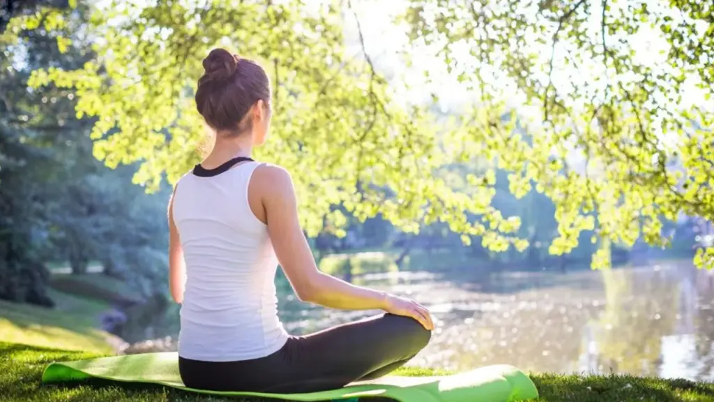 Person meditating with soft expression